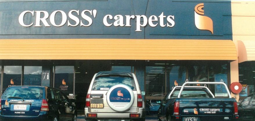 Cross' Carpets at 71 Upton Street, Bundall in the early 2000s with the branded fleet out front