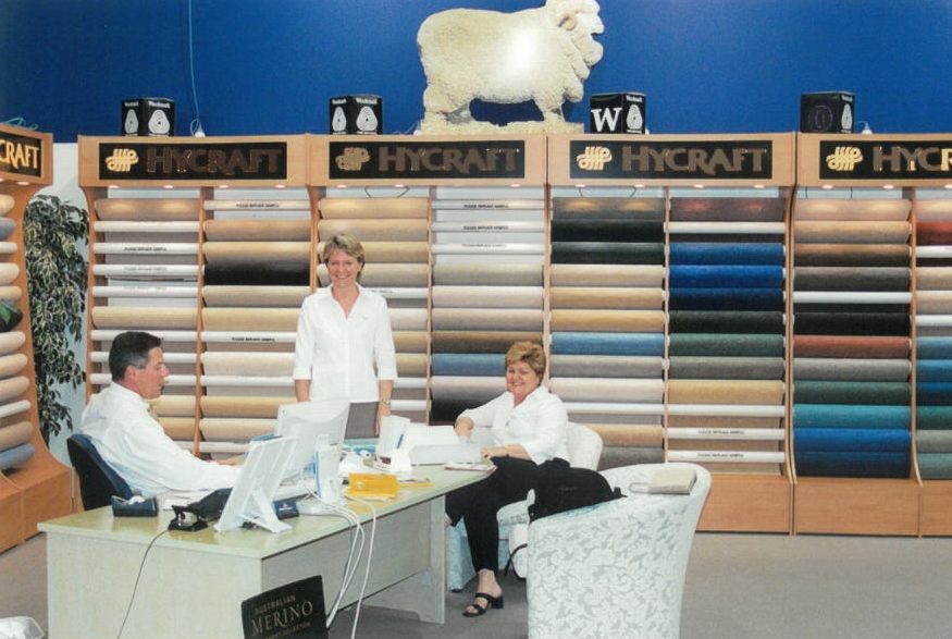 Inside the Cross Carpets showroom in the early 2000s, wool carpet stands and the merino display